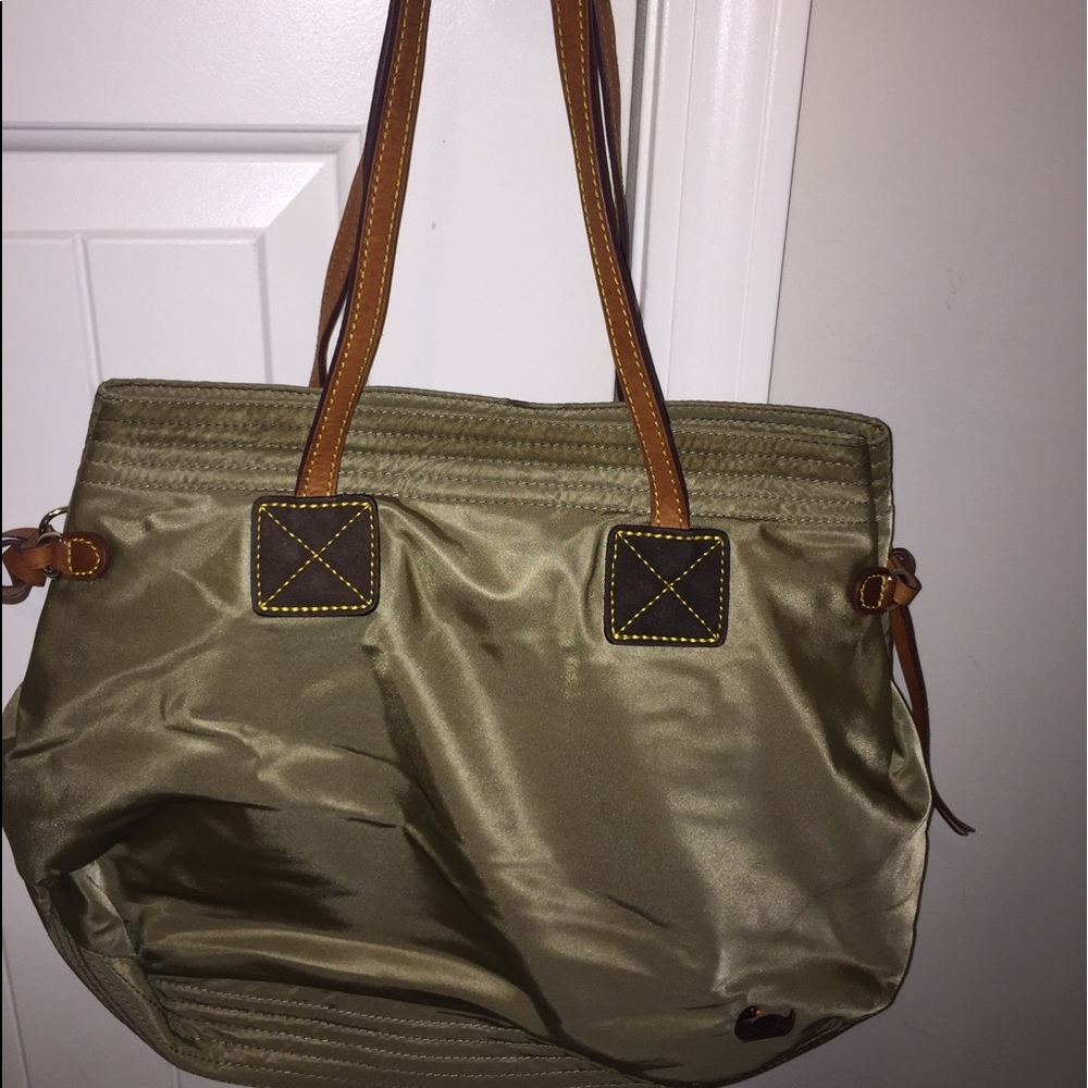 A green Dooney & Bourke purse